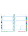 Open planner with colorful design on a white background
