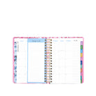 Planner with colorful tabs and a floral design on a white background