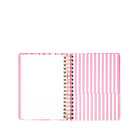 Spiral-bound planner with pink and white striped cover on a white background