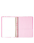Spiral-bound planner with pink and white striped cover on a white background