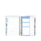 Woven planner with colorful tabs on a white background