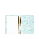 Spiral-bound notebook with a floral pattern on a white background