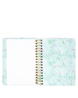 Spiral-bound notebook with a floral pattern on a white background
