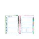 Open planner showing a weekly layout with colorful tabs on a white background