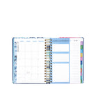 Open planner with monthly and weekly layout on a white background