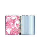 planner with pink floral design on one side and plain pages on the other, on a white background.