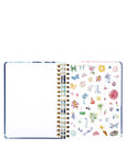 planner with colorful stickers on a white background