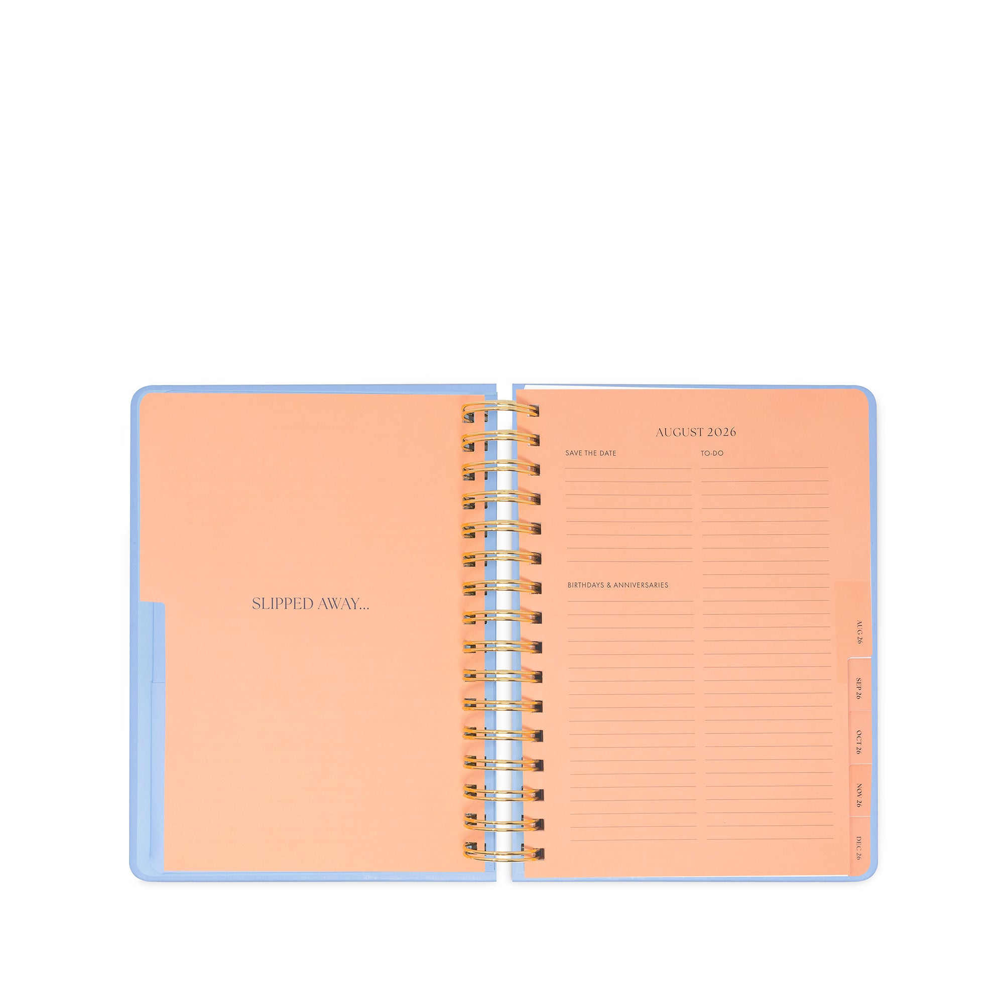 Open spiral-bound planner with peach interior pages on a white background