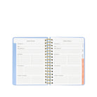Open planner with vacation planner section on a white background