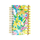 Floral planner with gold rings on a white background