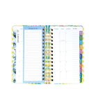 Planner with colorful tabs on a white background