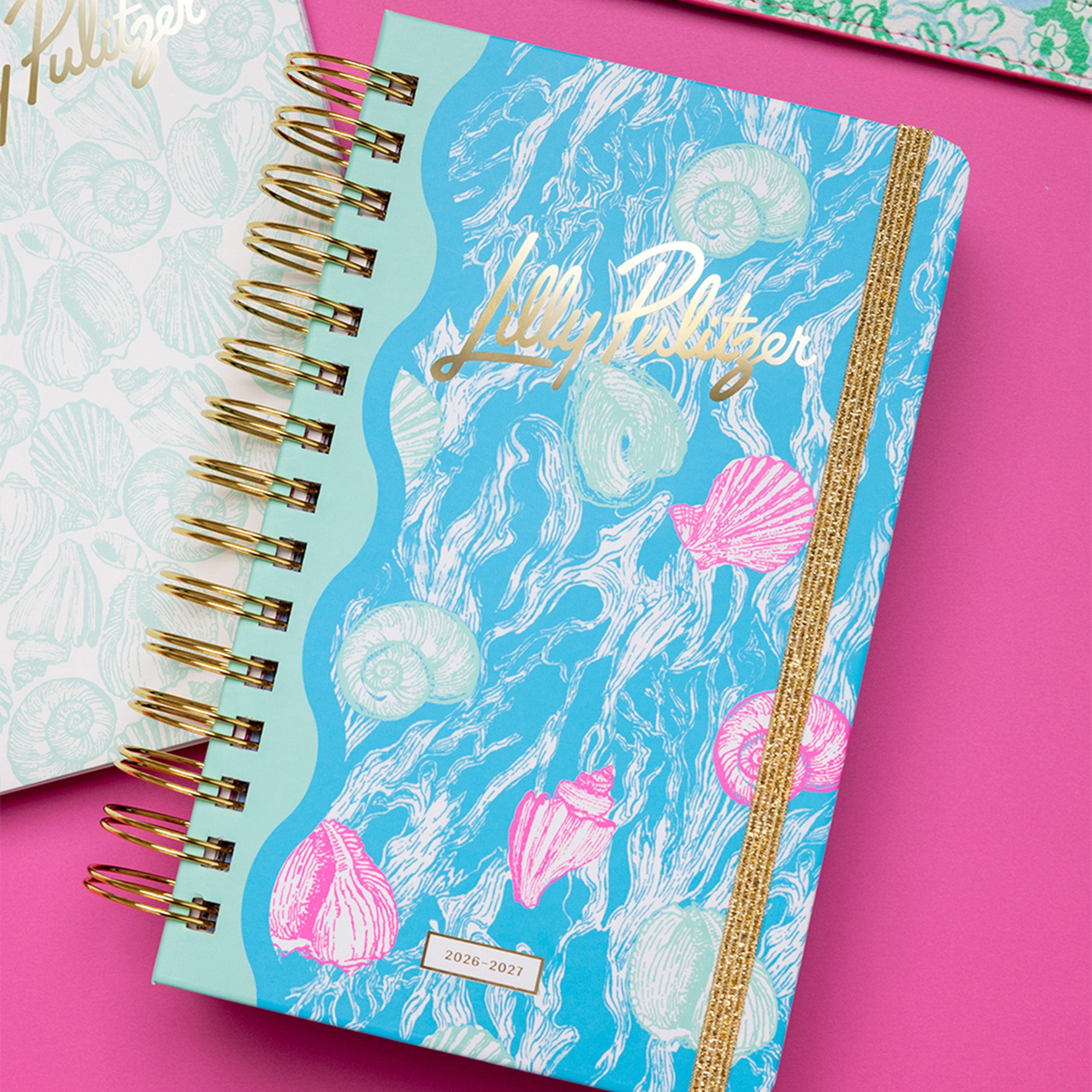 Lilly Pulitzer planner with shell design on a pink background