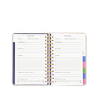 Open planner with goal tracker pages on a white background