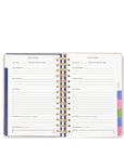 Open planner with goal tracker pages on a white background