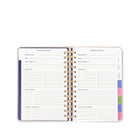 Vacation planner with colorful tabs on a white background