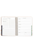 Open planner showing weekly schedule layout on white background