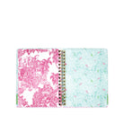 Open planner with pink and white palm tree design on one page and light blue and green patterned design on the other, on a white background.