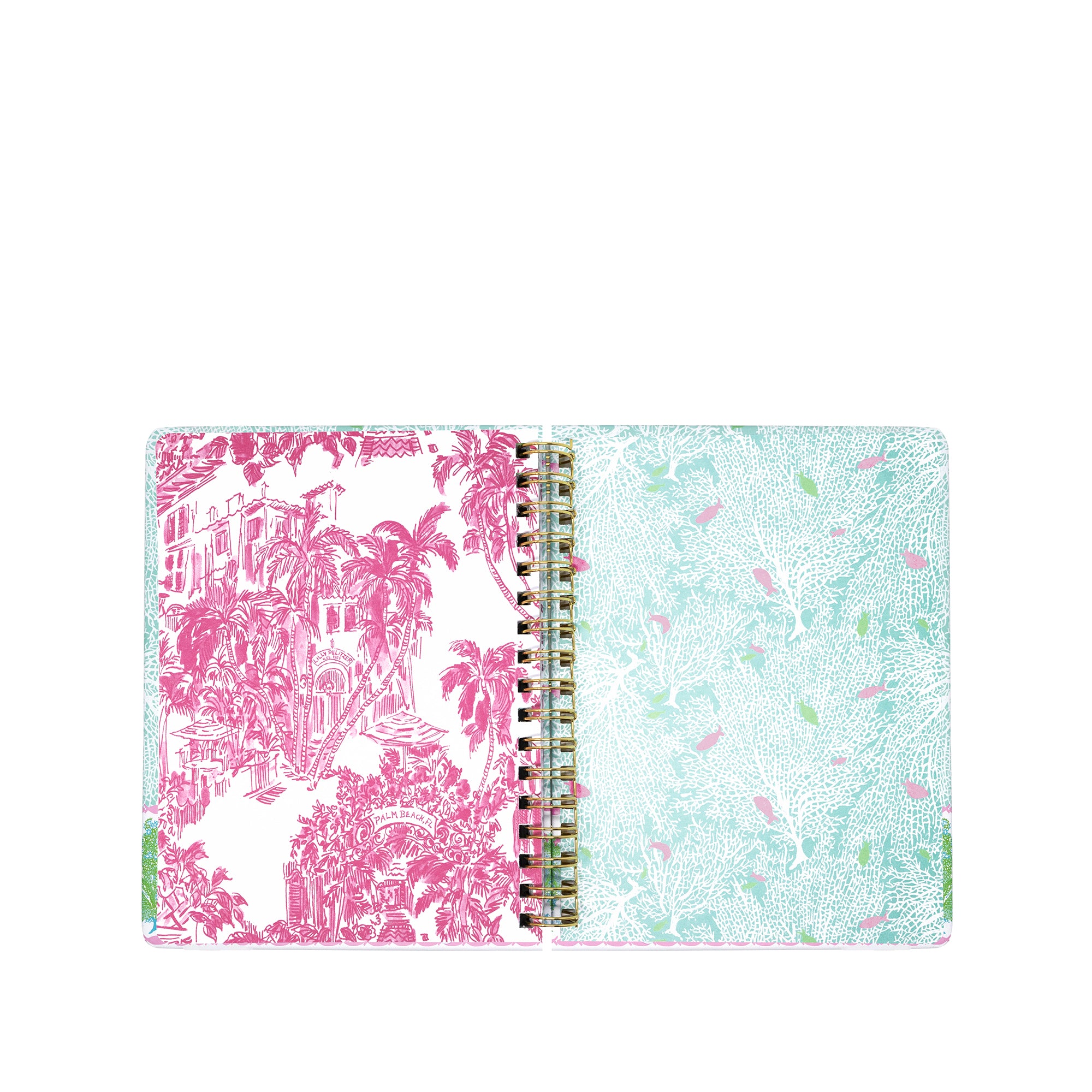 Open planner with pink and white palm tree design on one page and light blue and green patterned design on the other, on a white background.