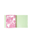 planner with pink floral and green striped design on a white background