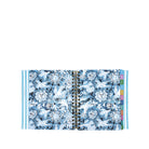 Open planner with blue floral design on a white background