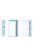 Spiral-bound planner with monthly and weekly views on a white background