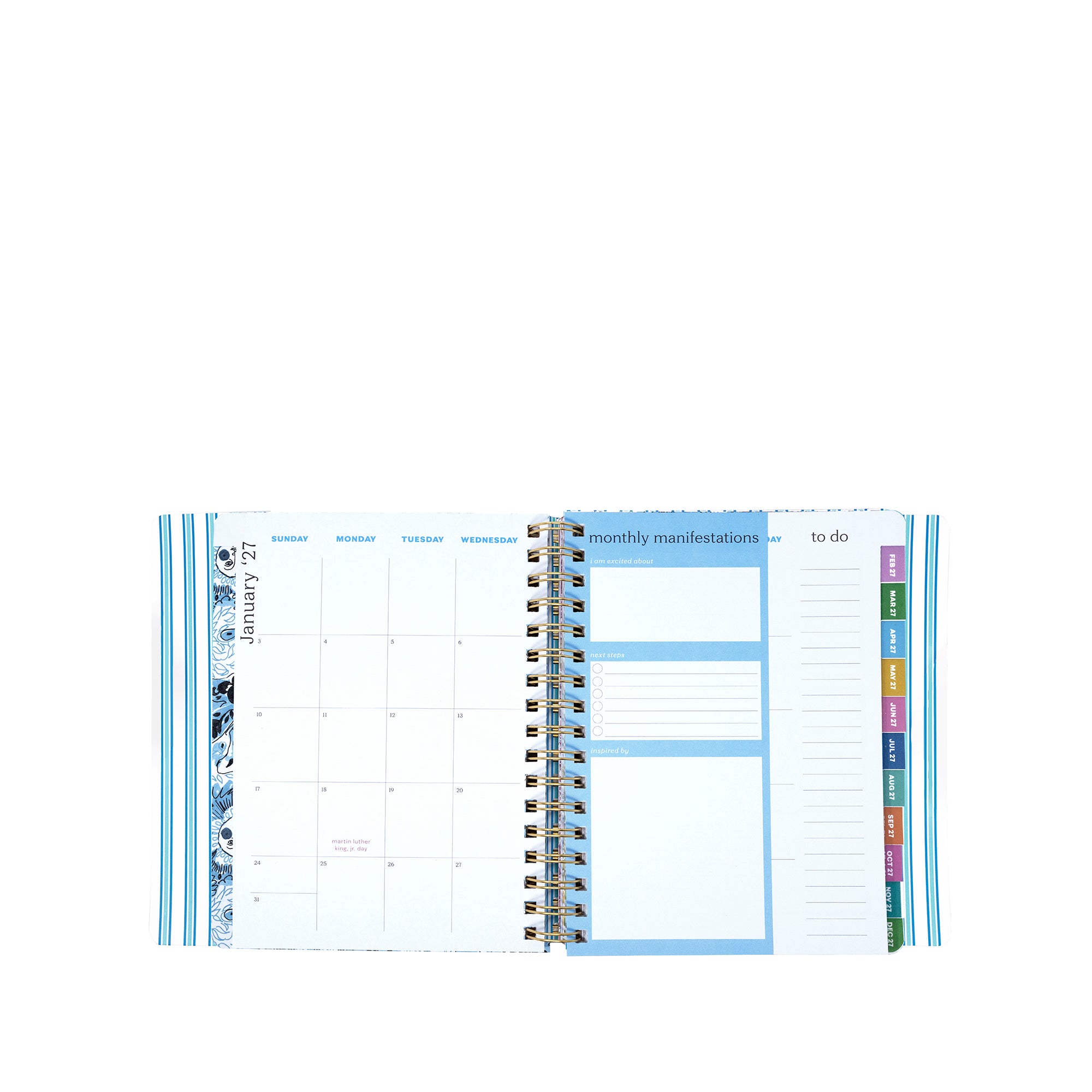 Spiral-bound planner with various sections on a white background