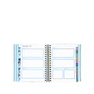Spiral-bound planner with monthly layout on a white background