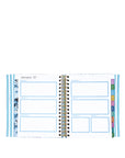 Spiral-bound planner with monthly layout on a white background