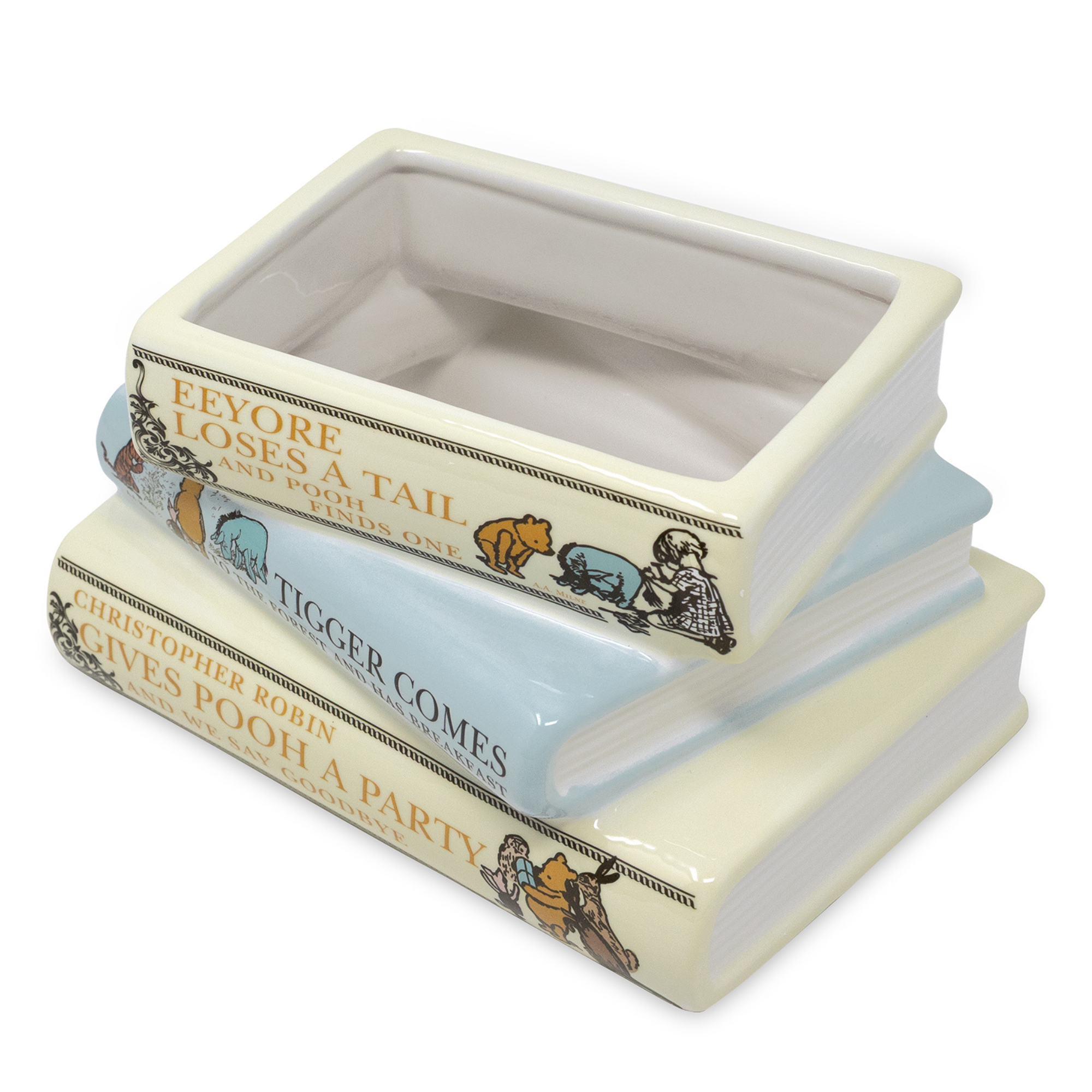Stack of decorative books with Winnie the Pooh illustrations on a white background