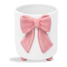 White ceramic planter with a pink bow on a white background