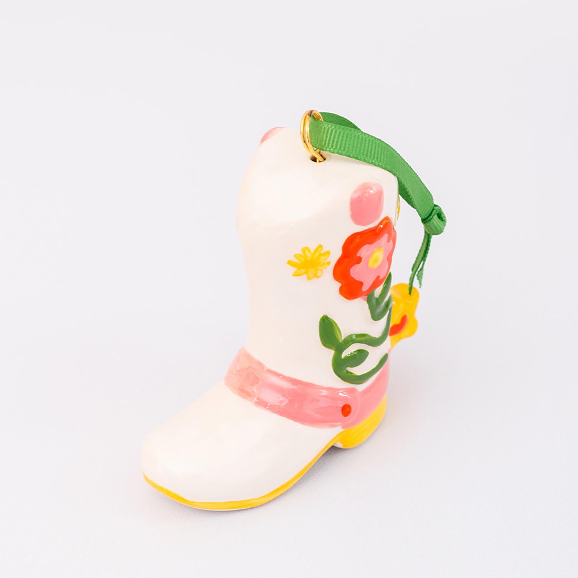 Ornament cowboy boot with floral design on a white background