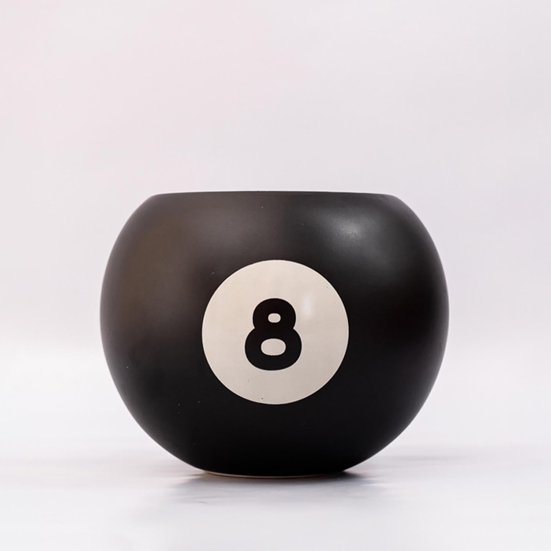 Black billiard ball with number 8 on a white background