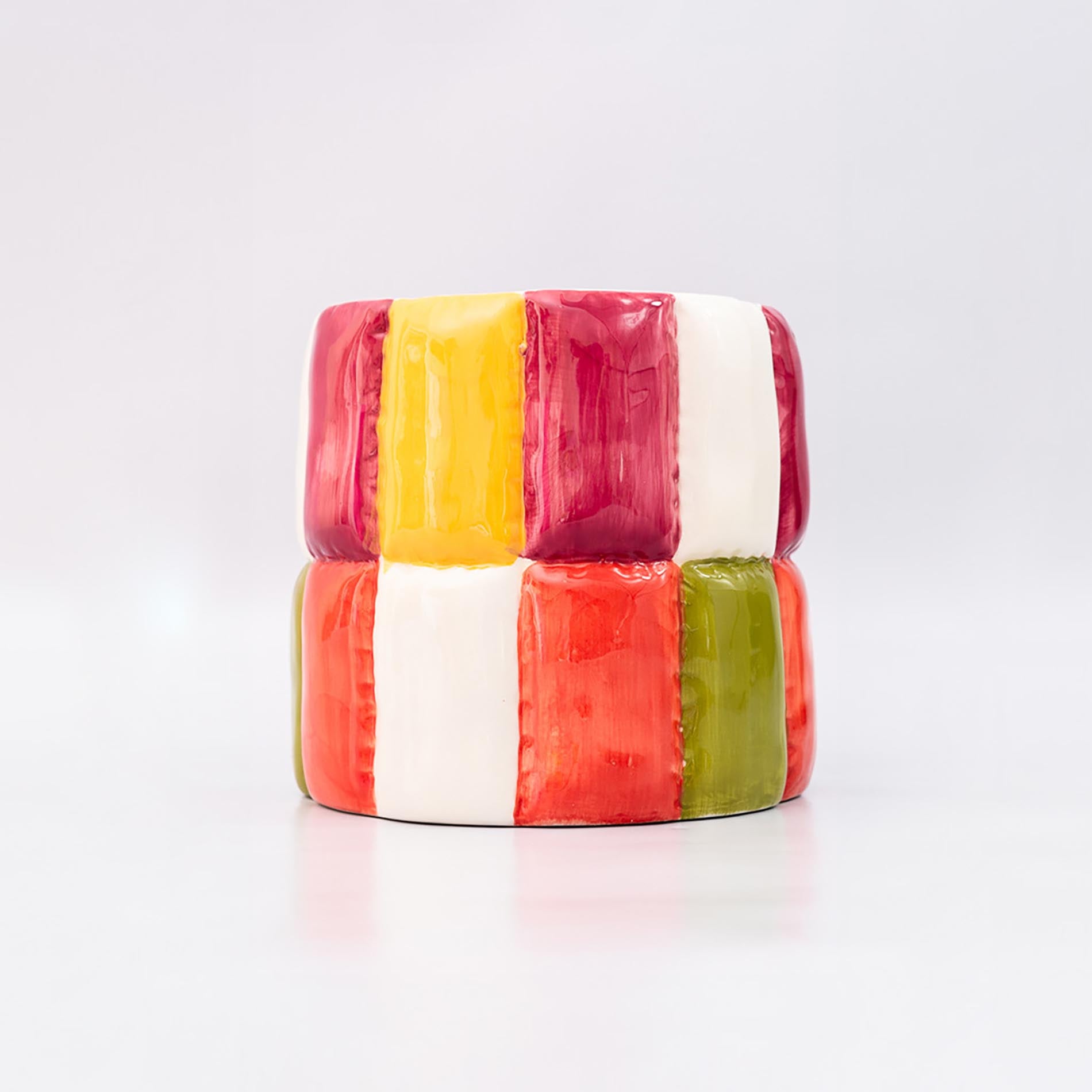 Colorful block-patterned planter on a white background