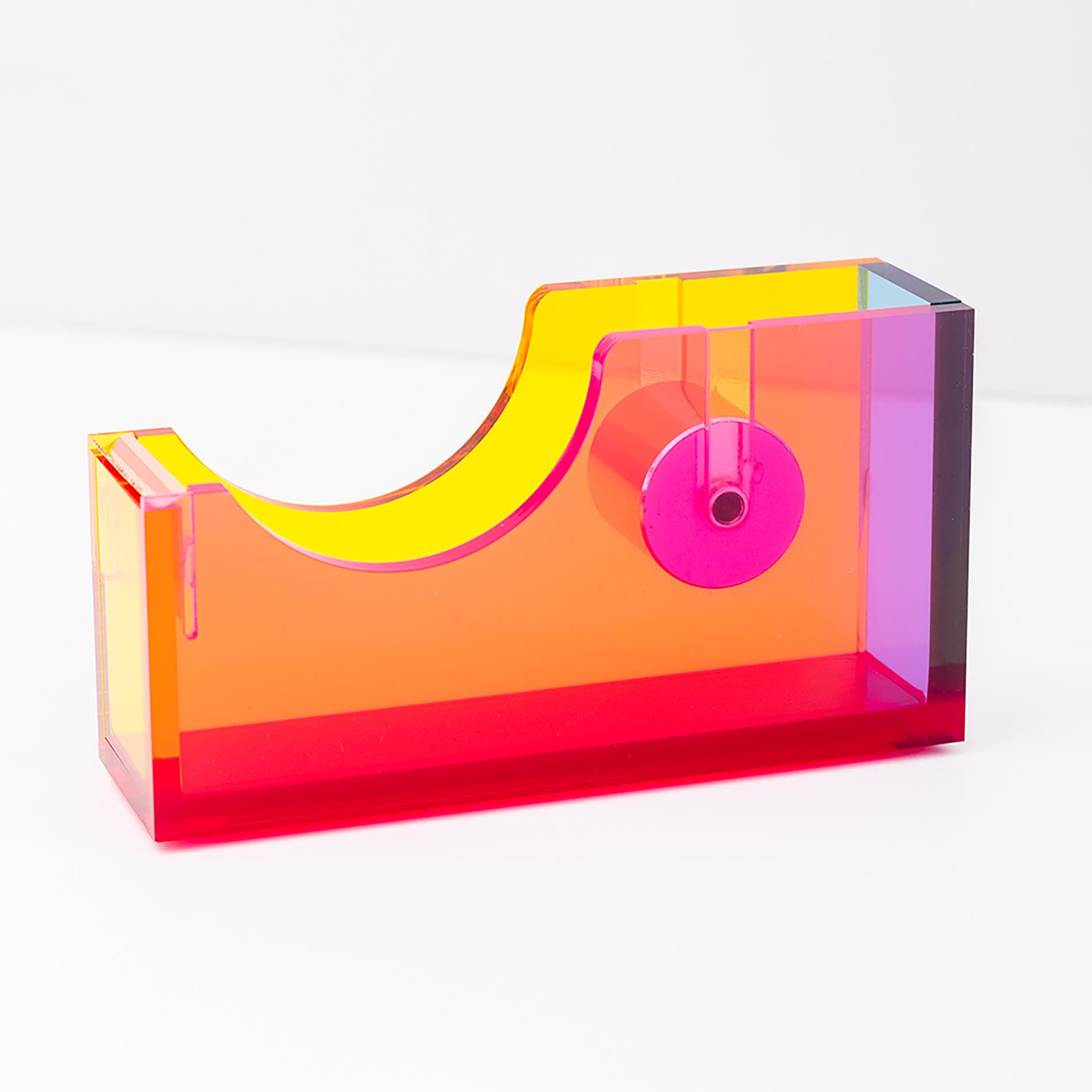 Colorful tape dispenser with pink tape on a white background