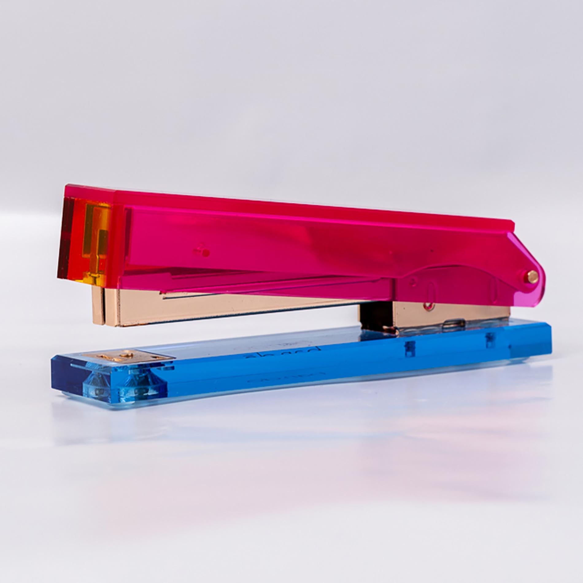 Colorful stapler with pink and blue design on a white background