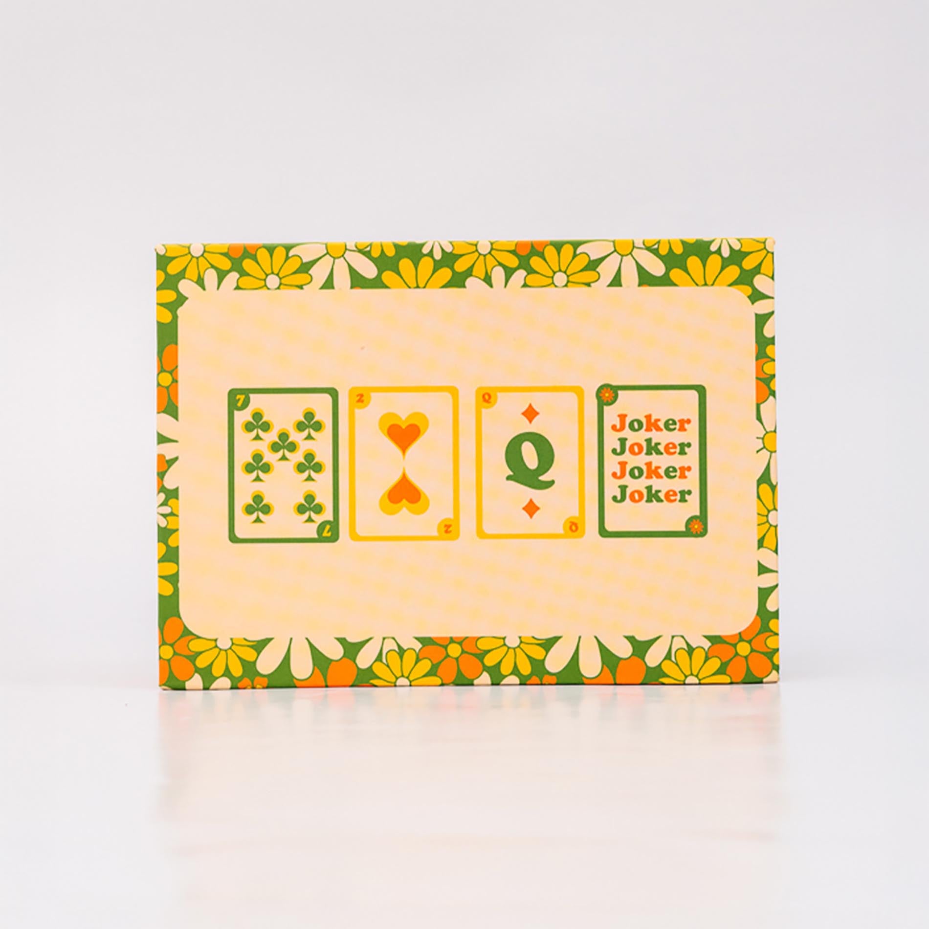 Pack of playing cards with floral border and card symbols on a white background