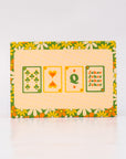 Pack of playing cards with floral border and card symbols on a white background