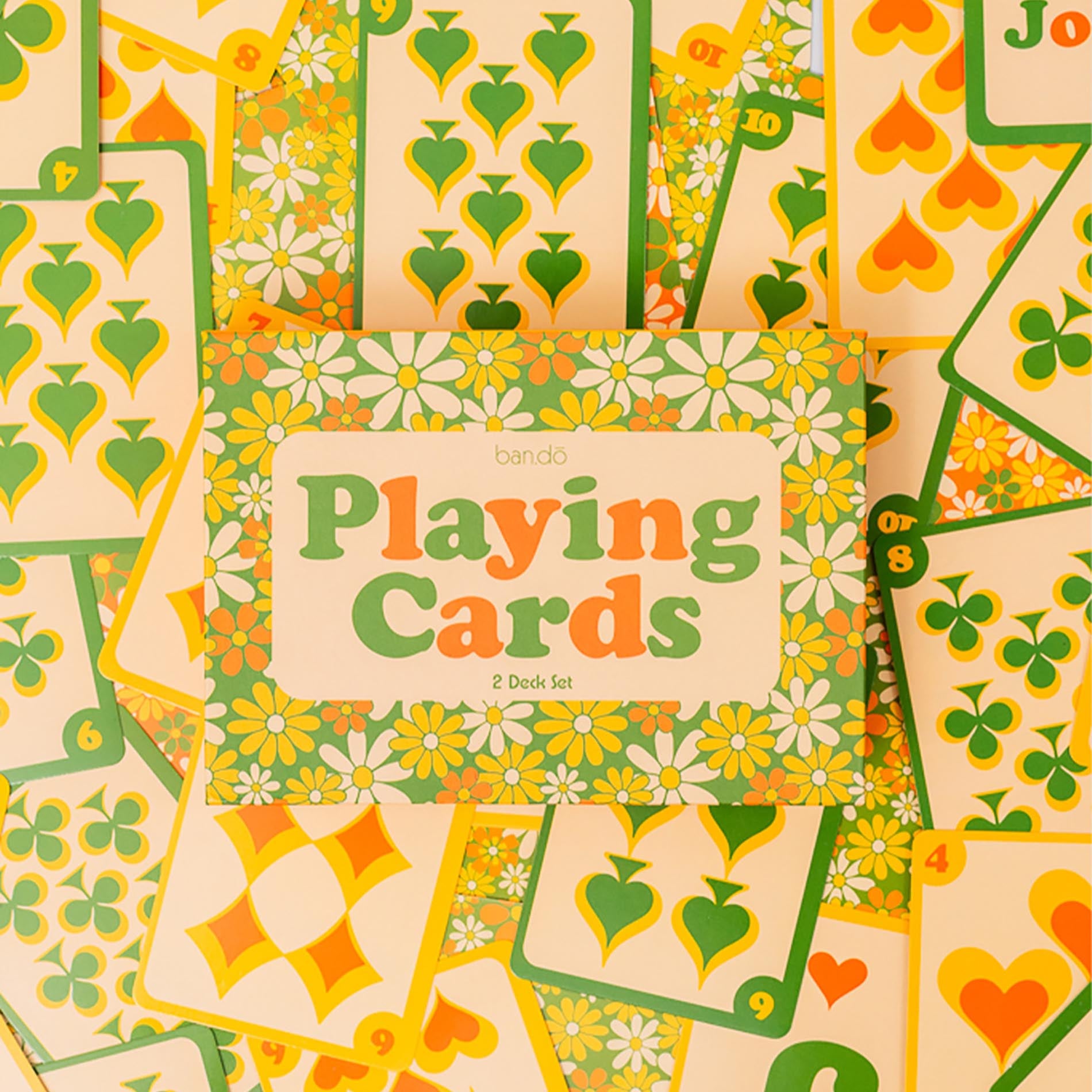 Set of playing cards with floral and nature-themed design, featuring hearts, flowers, and leaves.