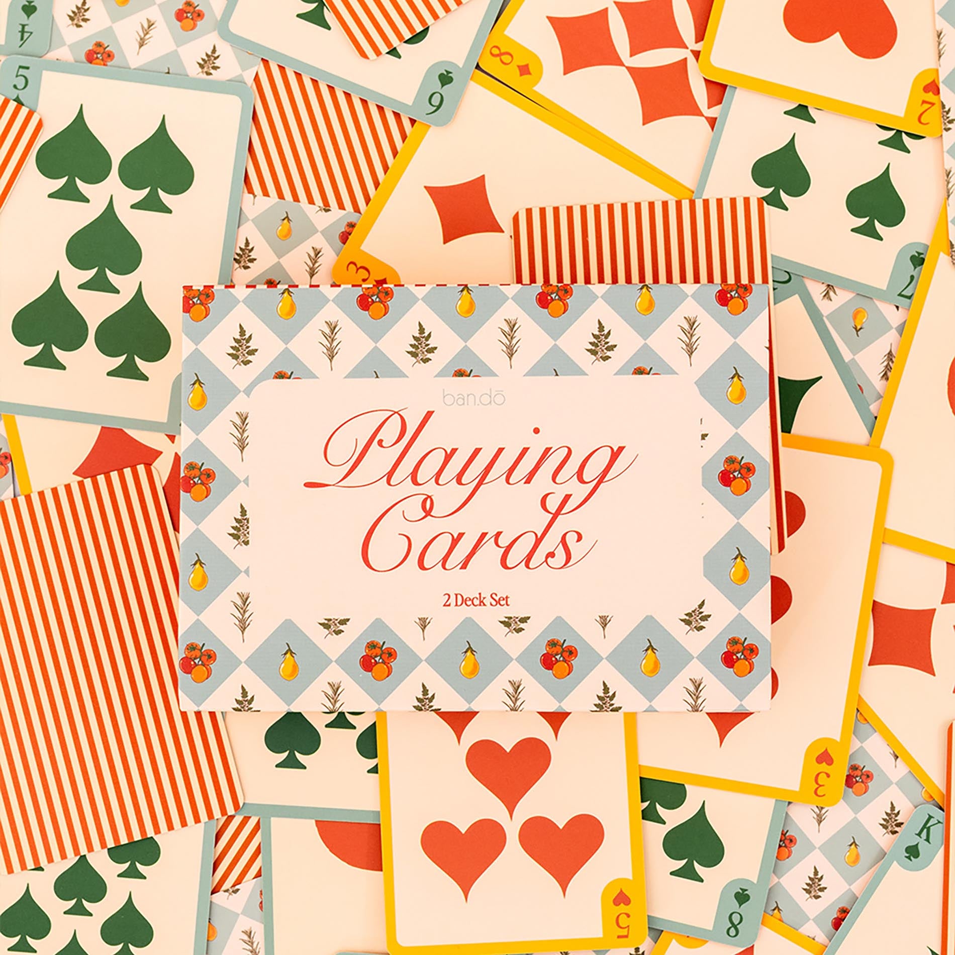 Collection of playing cards with decorative designs and a central card labeled 'Playing Cards'.