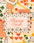 Collection of playing cards with decorative designs and a central card labeled 'Playing Cards'.
