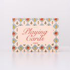 Playing cards box with decorative pattern on a white background
