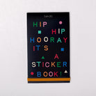 Sticker book cover with colorful text on a black background
