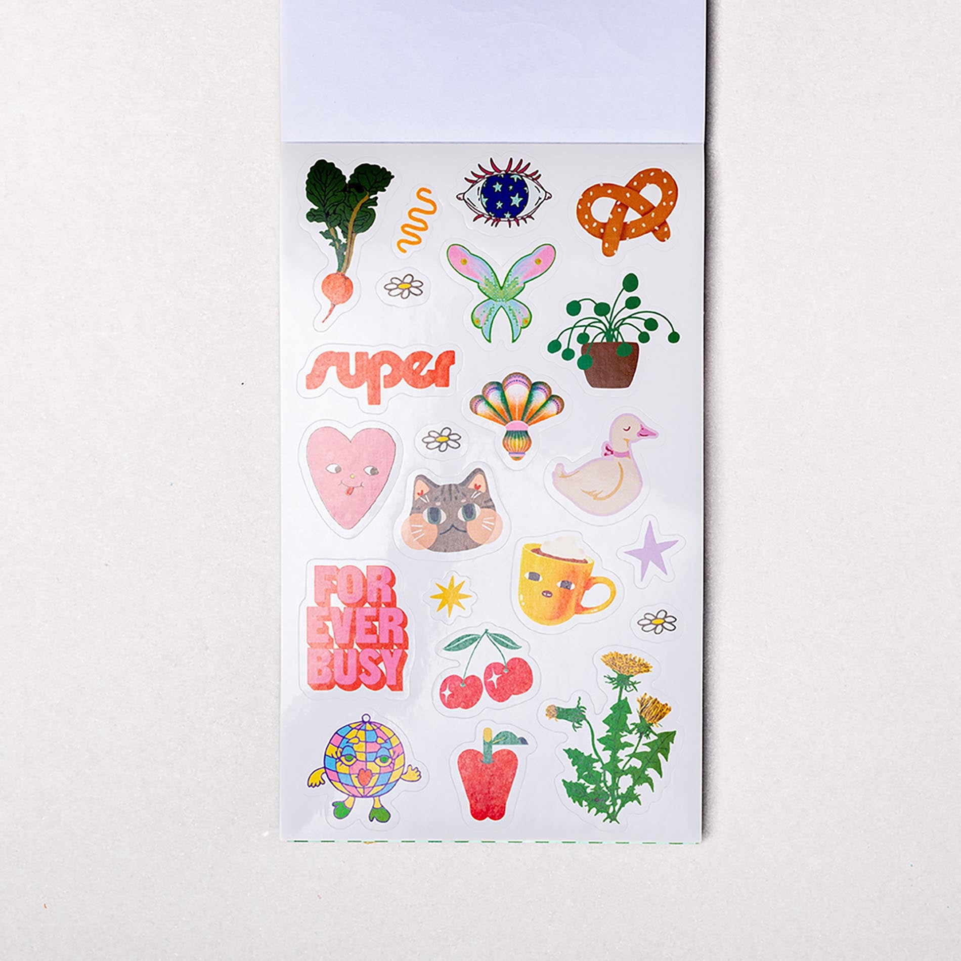 Sheet of colorful stickers with various designs on a white background