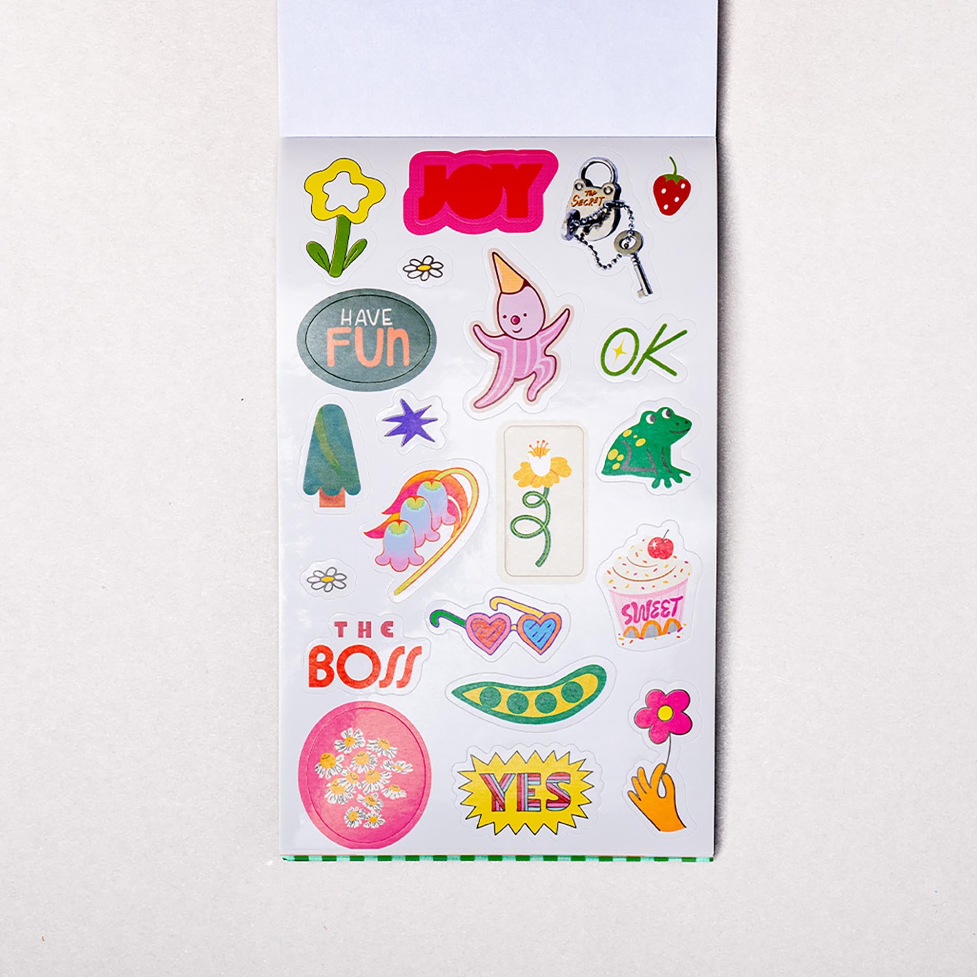 Sheet of colorful stickers with various designs on a white background