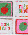 Four colorful coasters with text and graphics on a white background