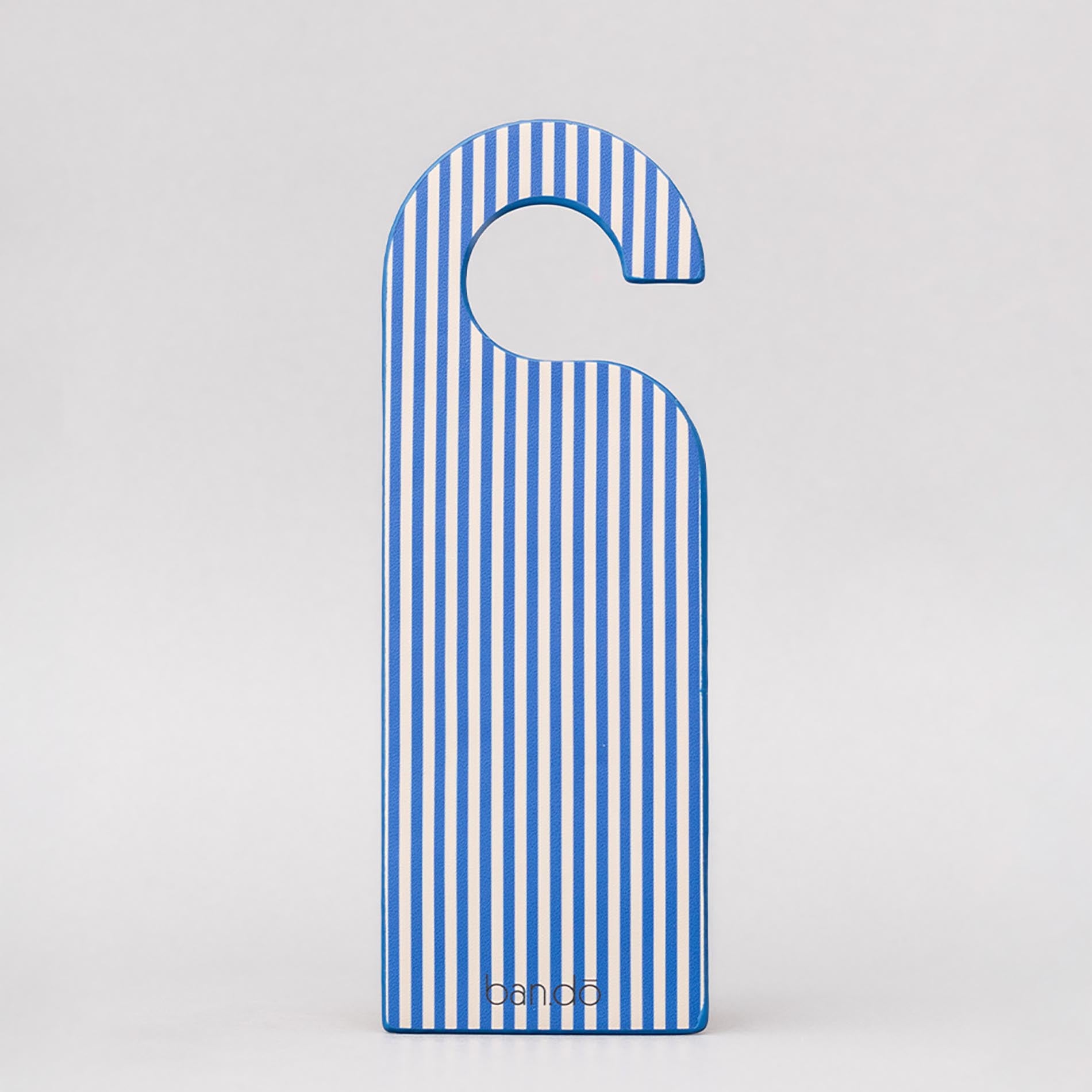 Blue and white striped door hanger on a light gray background