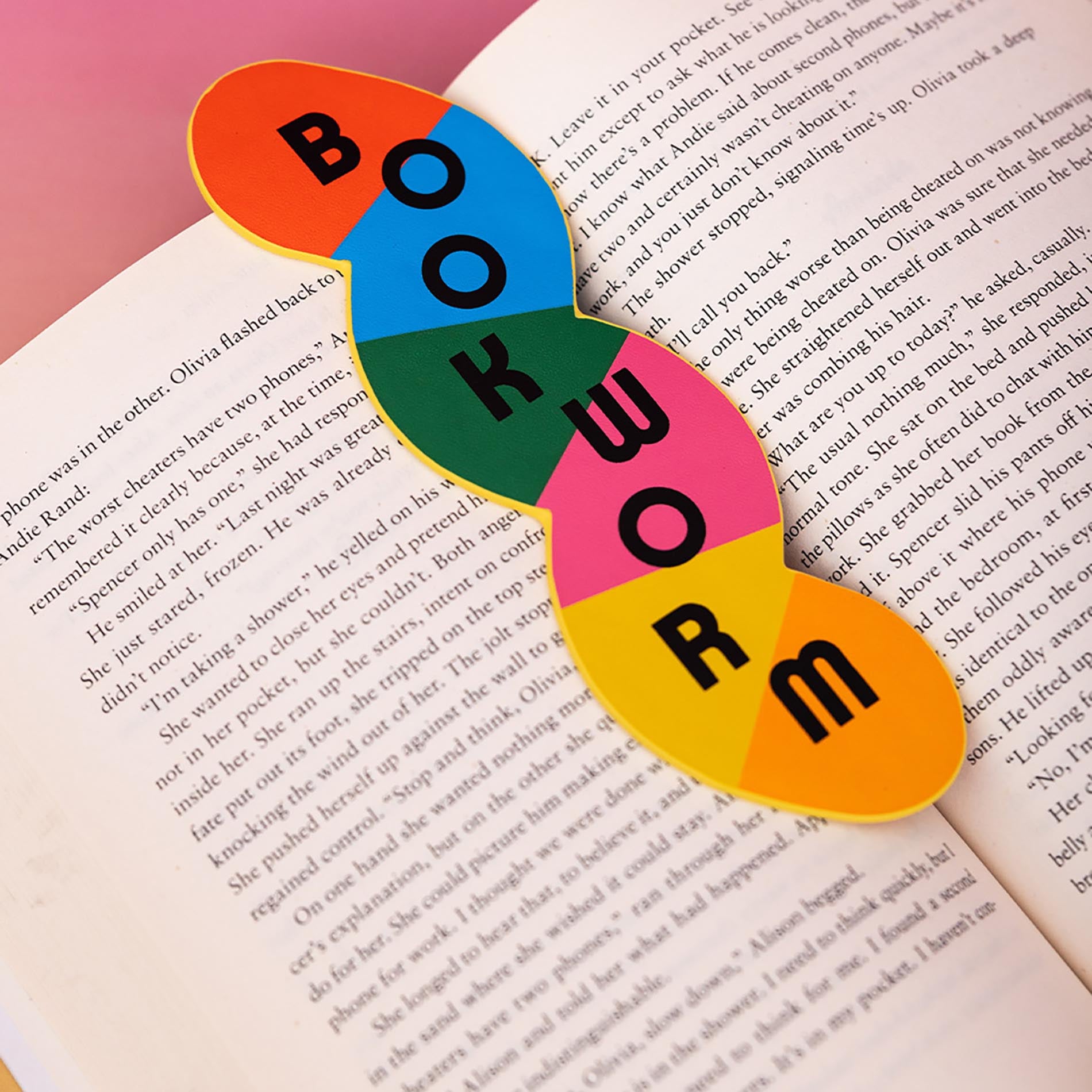 Colorful 'Bookworm' shaped bookmark on an open book