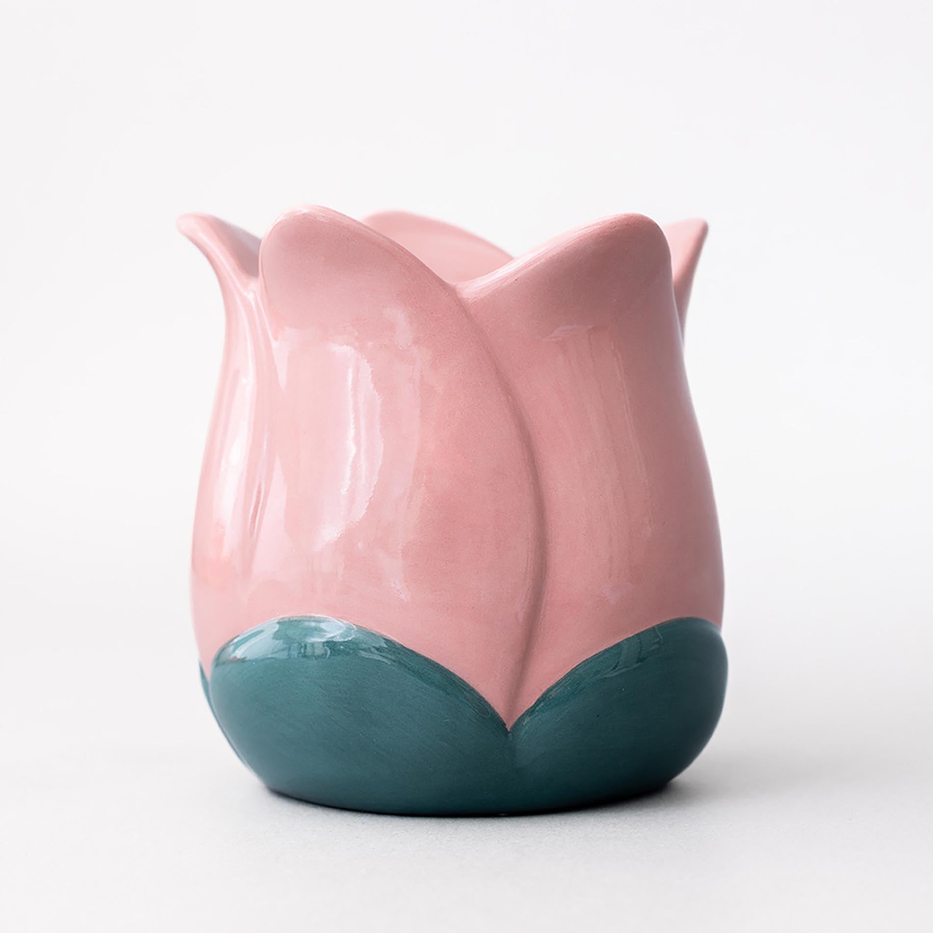 Pink and teal ceramic tulip-shaped vase on a white background