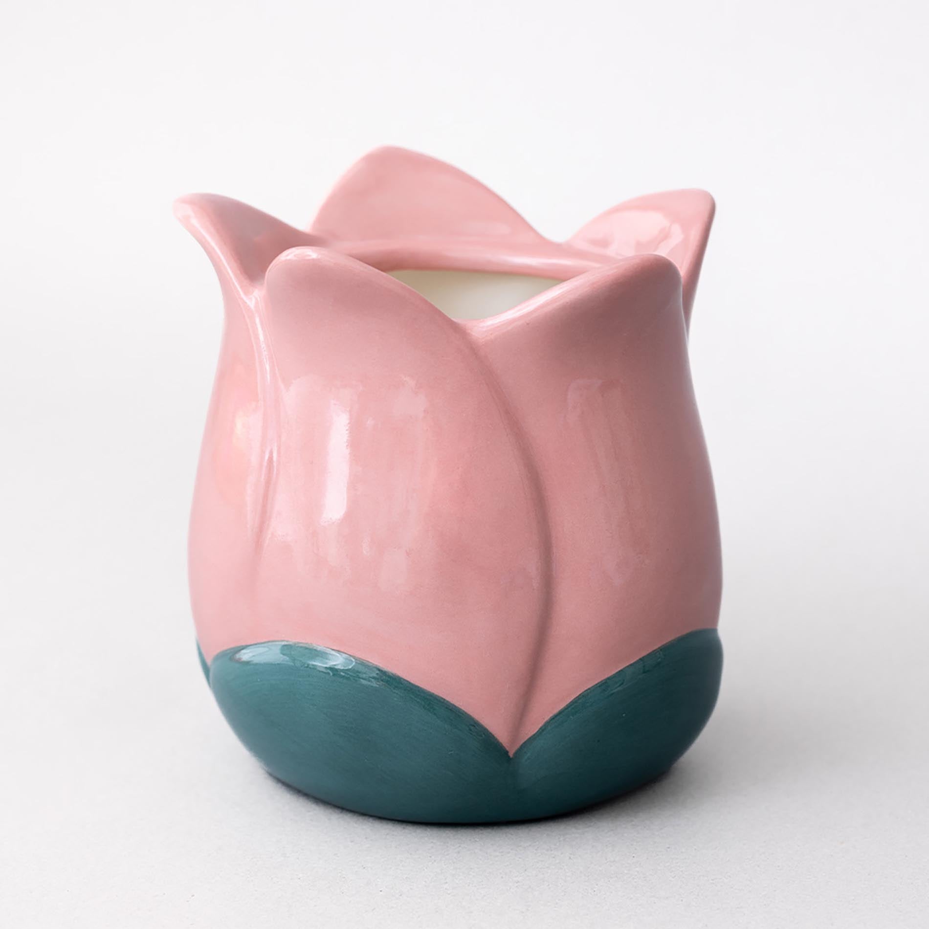 Pink and teal ceramic tulip vase on a white background