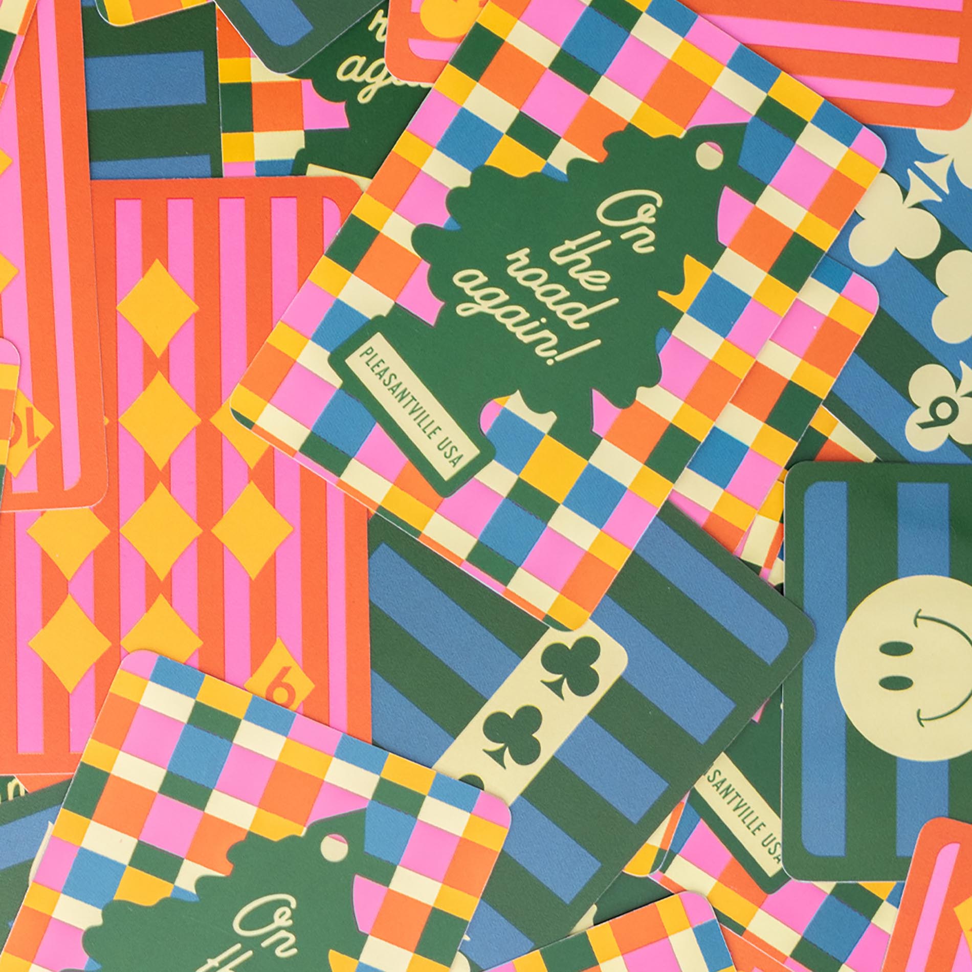 Colorful patterned fabric with text and graphics, featuring a checkered design.